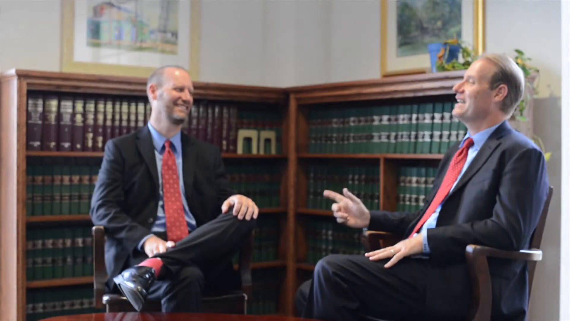 Ben and Jon David talking in a law library.